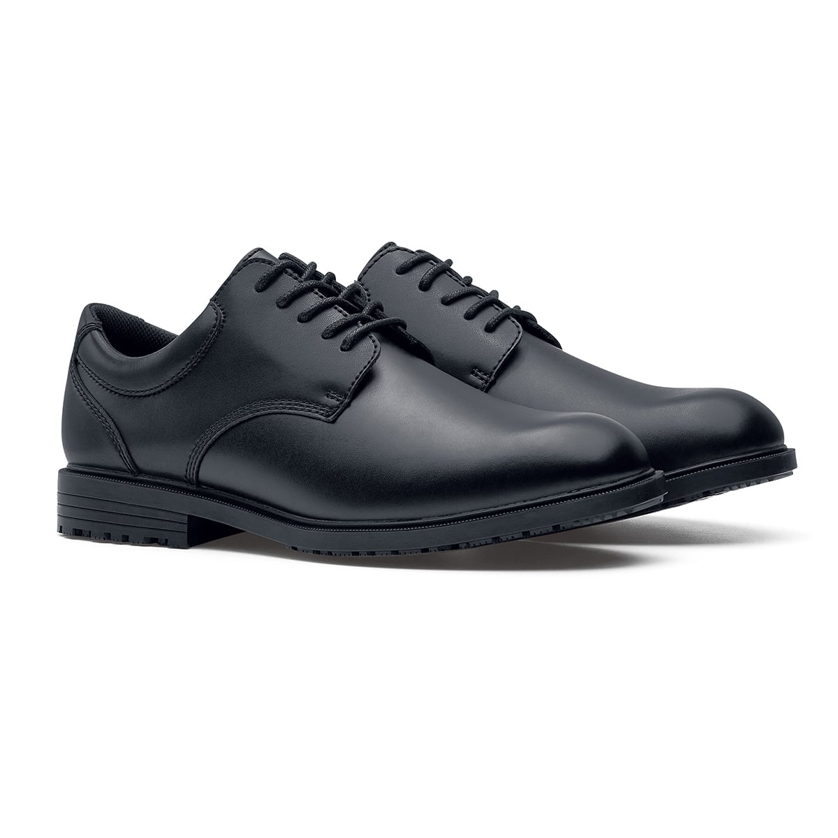 The Shoes for Crews Cambridge III is a slip-resistant leather dress shoe, with removable cushioned insoles and a padded comfort collar, pair seen in profile on the left.