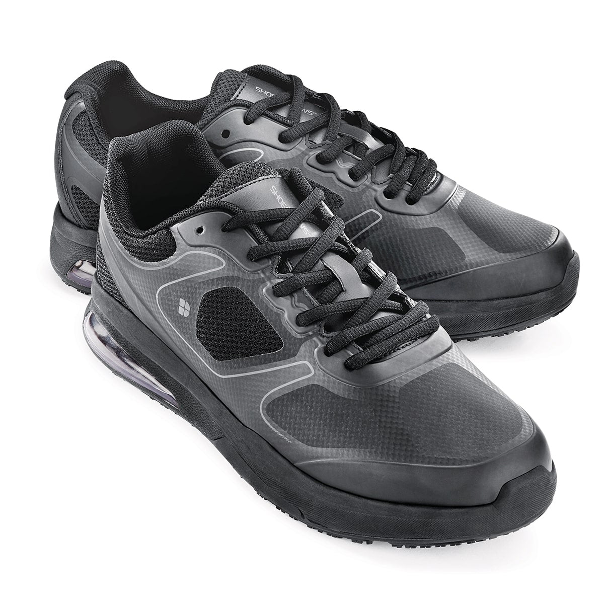 The Evolution II Black from Shoes For Crews are slip-resistant and water-resistant trainers, pair seen from the right side, emphasised on the tip of the right  shoe.