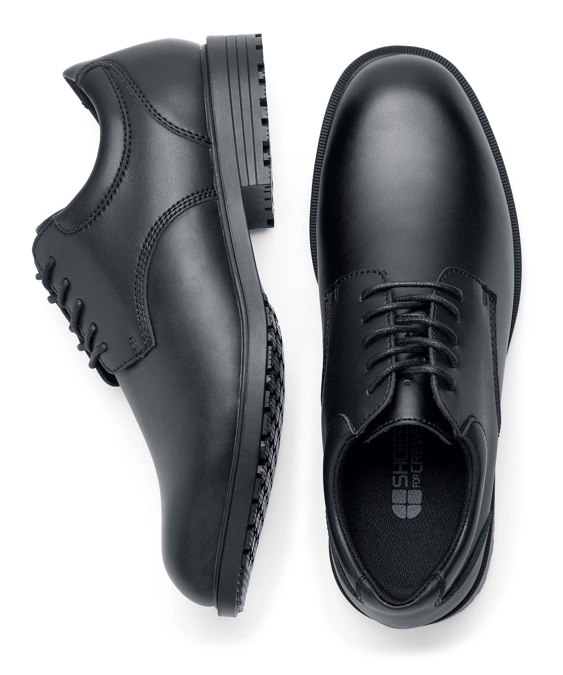 The Shoes for Crews Cambridge III is a slip-resistant leather dress shoe, with removable cushioned insoles and a padded comfort collar, pair seen from above and from the side.