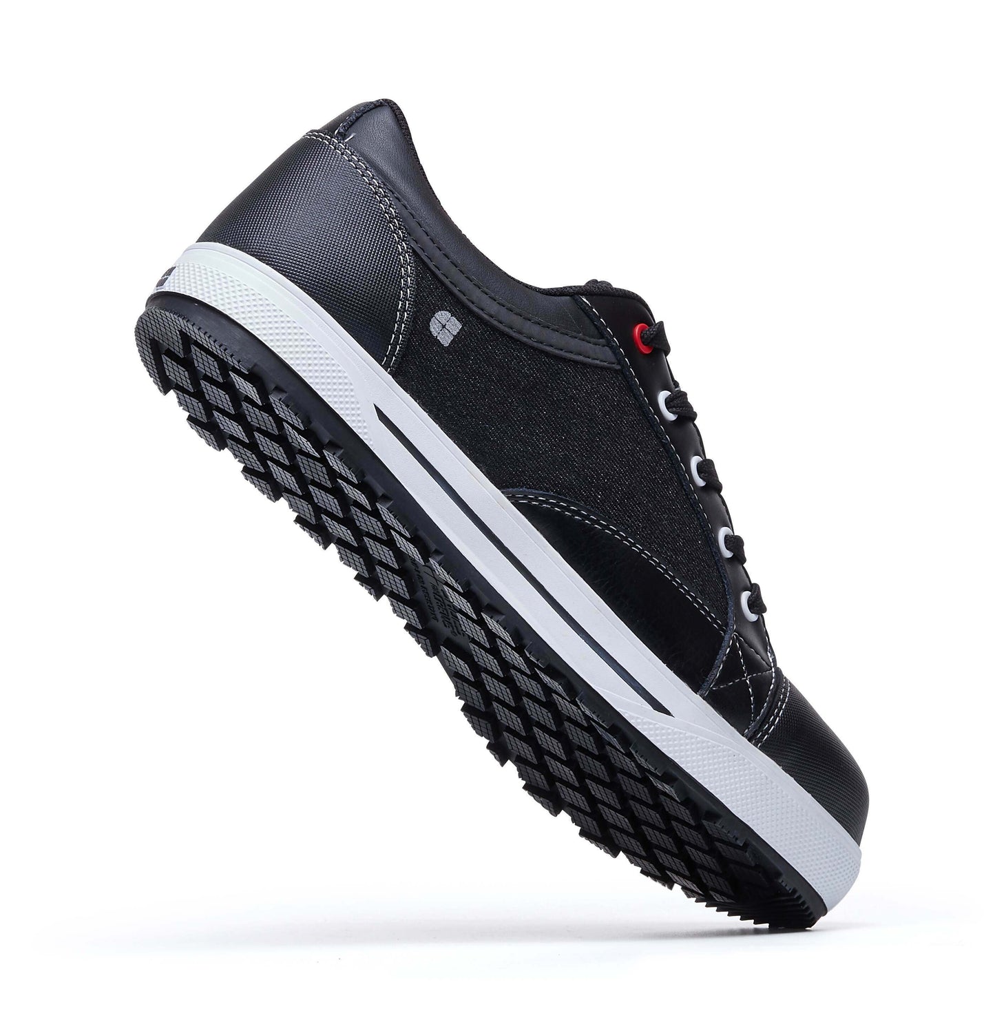 The Fergus Denim from Shoes For Crews is an slip-resistant safety shoe with a waterproof leather upper and a nanocomposite toe cap (200 joules), seen from the perpendicular.