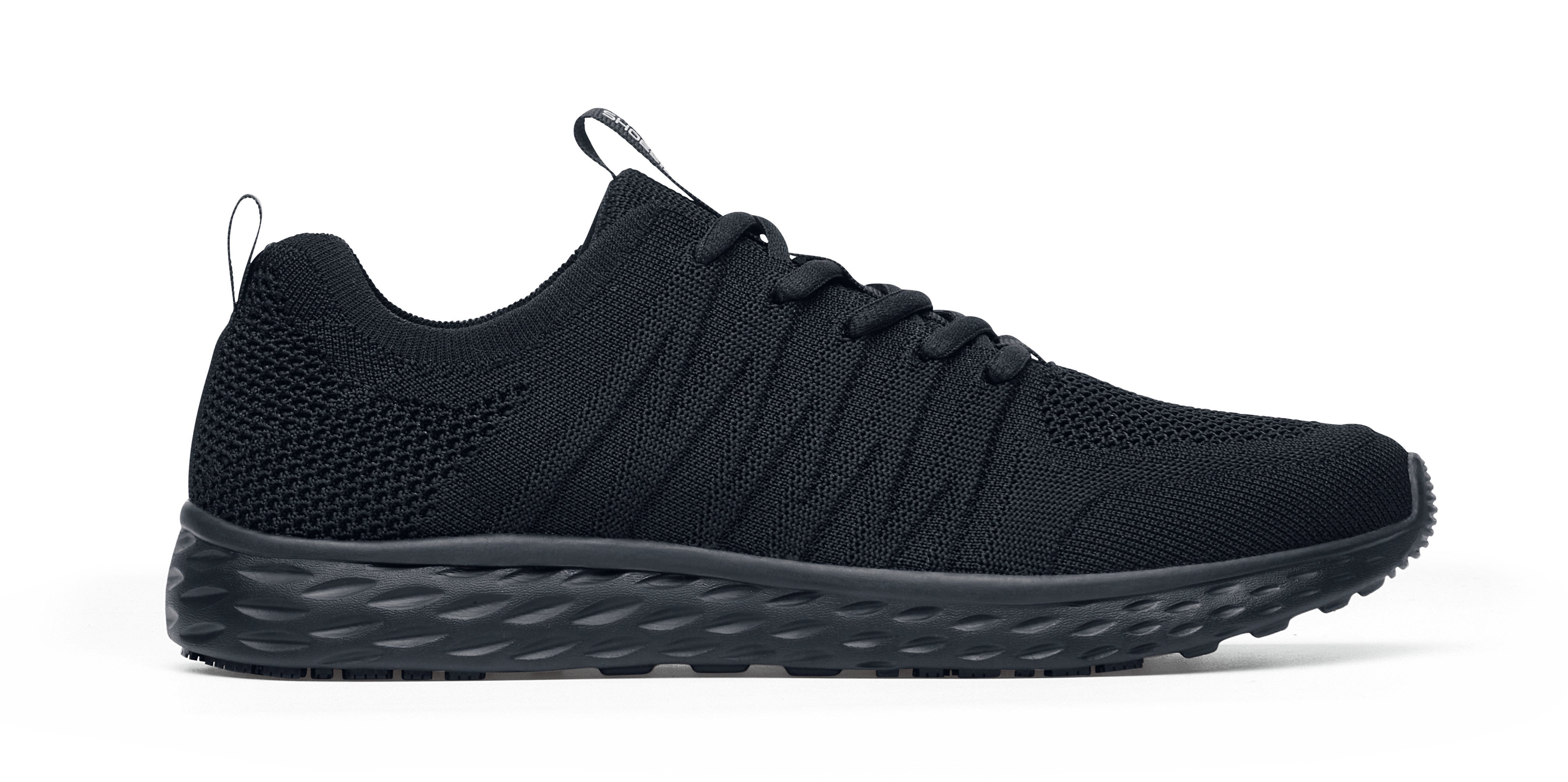 The Everlight Ce Mens Black from Shoes For Crews are slip-resistant trainers with TripGuard technology, removable cushioned insoles and are also breathable, seen from the right.