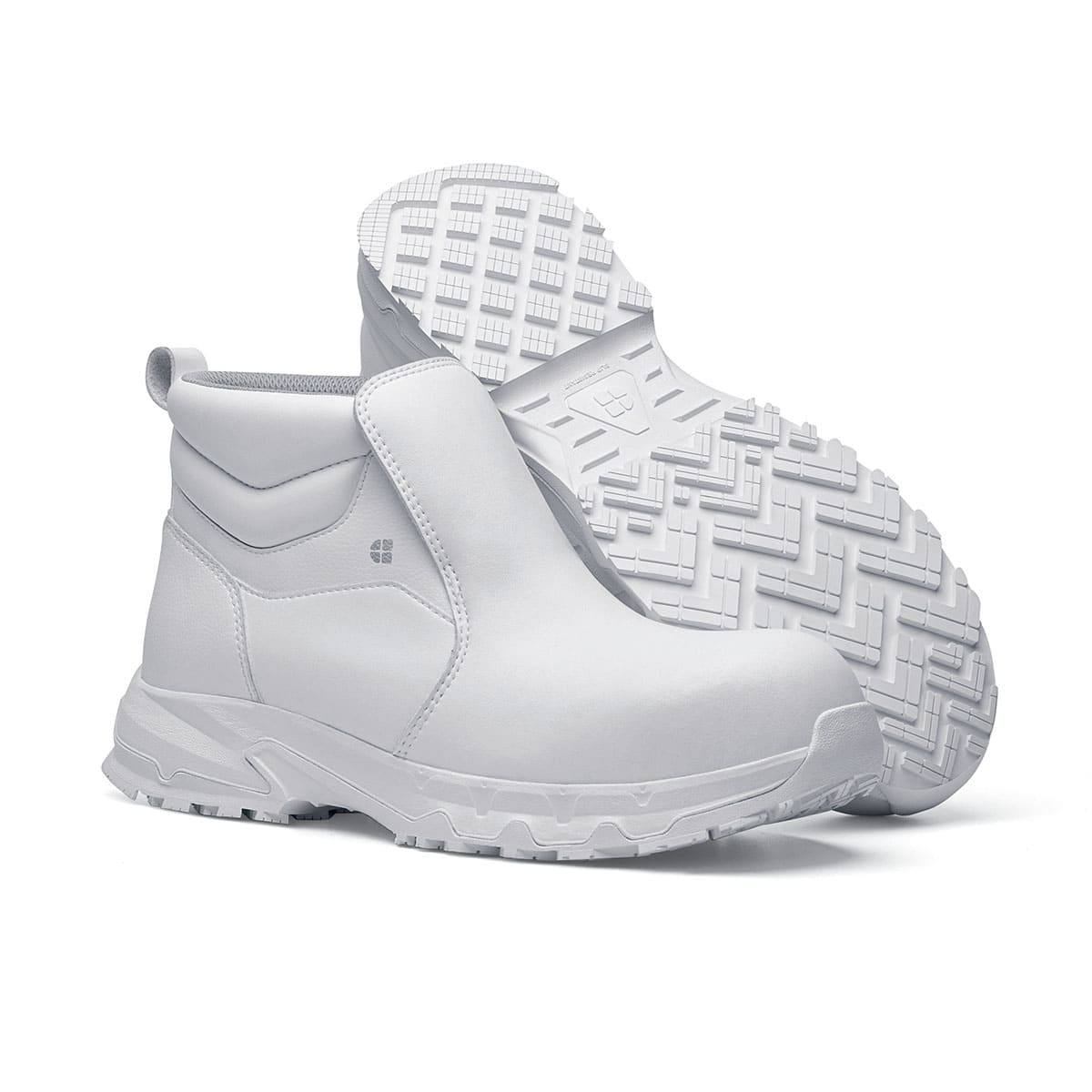 The Inny from Shoes For Crews is a safety shoe with a slip-resistant, clog-resistant upper sole and our advanced TripGuard technology, pair seen from the right side and the sole.