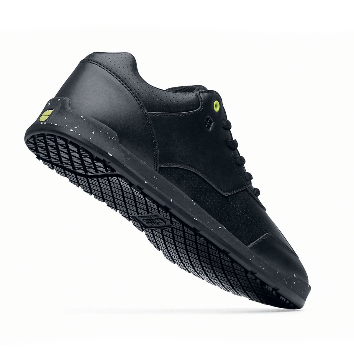 The Liberty Eco from Shoes For Crews are sustainable, slip-resistant trainers that provide comfort and safety throughout the day, seen from the perpendicular.