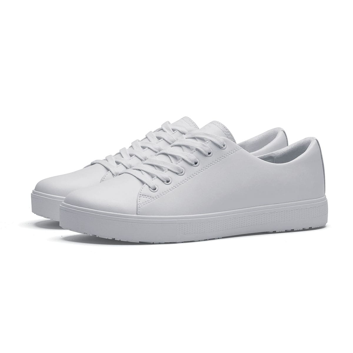 The Old School Low-Rider White from Shoes For Crews is a slip resistant lace-up designed to provide comfort throughout the day, pair seen in profile on the left.