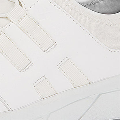 The Karina White by Lila from Shoes For Crews are black slip-resistant trainers that are lightweight and have Flex Tread technology, detailed photography.