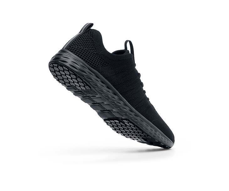 The Everlight Mens Black from Shoes For Crews are breathable slip-resistant trainers which are lightweight and easy to clean, seen from the perpendicular.