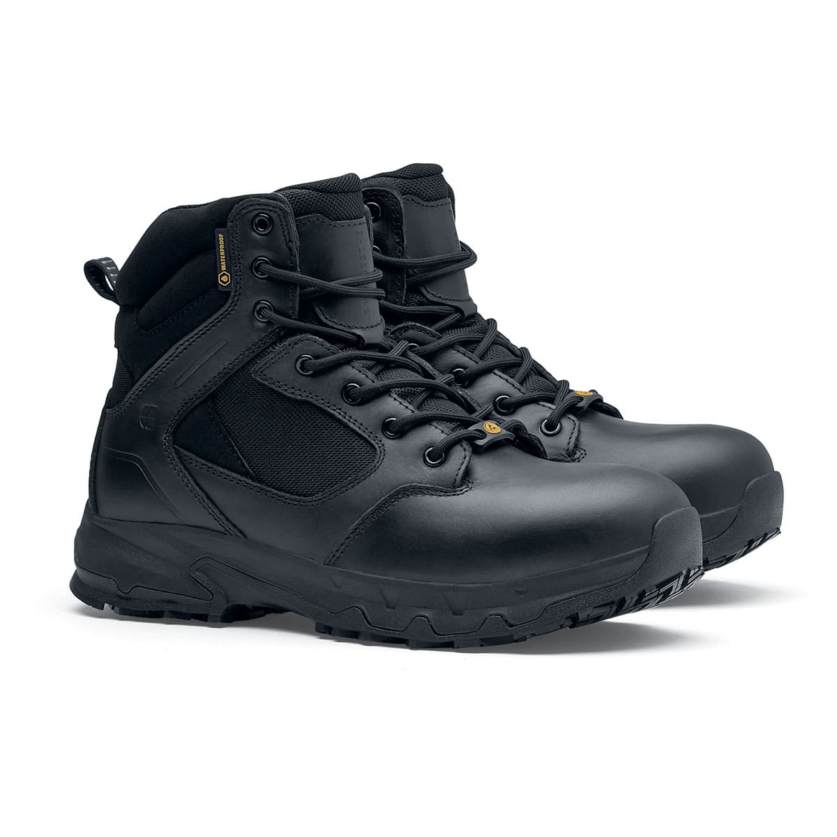 The Defence Mid from Shoes For Crews are waterproof, slip-resistant safety boots, pair seen in profile on the right.