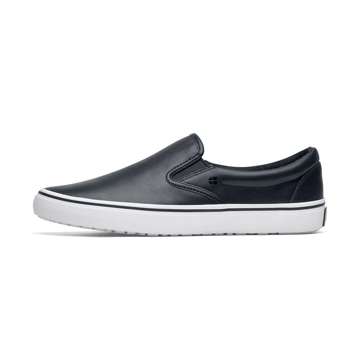 The Merlin Slip On Black and White from Shoes For Crews are slip-on trainers that are slip-resistant, lightweight, easy to clean and water-resistant, seen from the left.