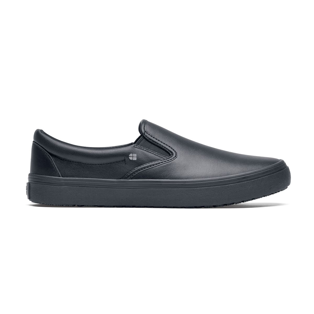 The Merlin Black from Shoes For Crews are slip-on slip resistant shoes with a lightweight design and constructed from genuine leather that has been specially treated to repel liquids from the surface, seen from the right.