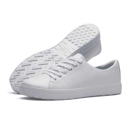 The Old School Low-Rider White from Shoes For Crews is a slip resistant lace-up designed to provide comfort throughout the day, pair seen from the left side and the sole.