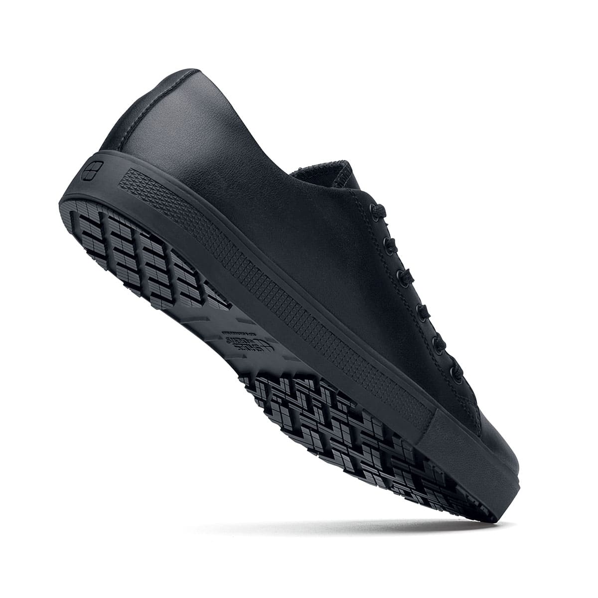 The Old School Low-Rider Black Gladiator Outsole from Shoes For Crews is a slip resistant lace-up shoe designed to provide comfort throughout the day, seen from the perpendicular.